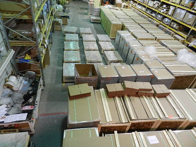 Warehouse aerial view showing hundreds of boxed components ready for dispatch